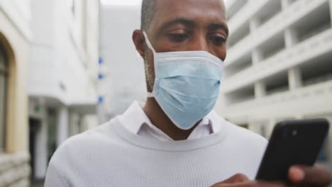 African-american-man-on-the-go-wearing-coronavirus-covid19-mask