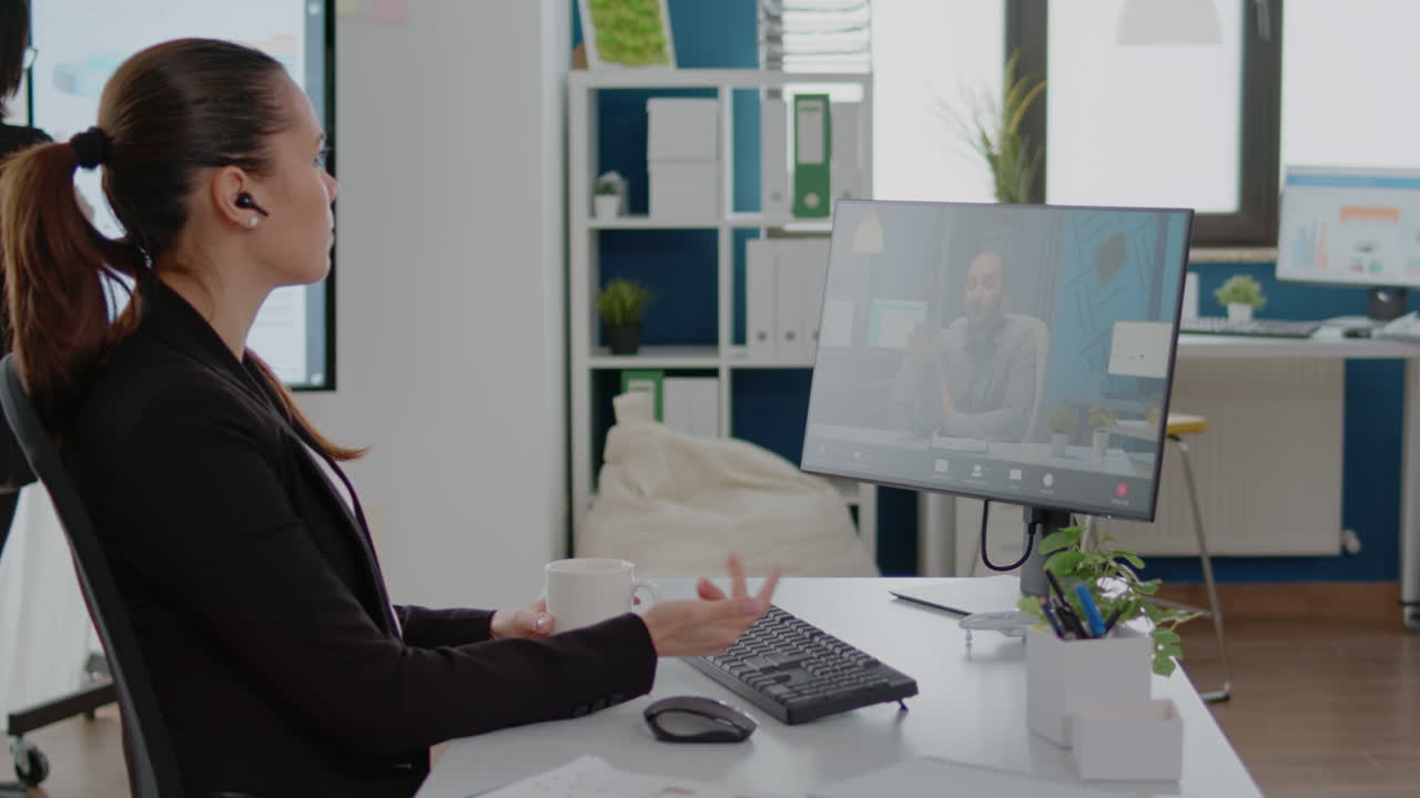 Woman talking to boss on video call communication