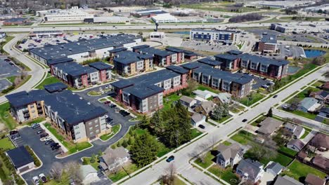 flyover of a suburban apartment complex near a freeway and shopping developments