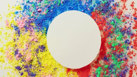 Video-of-multi-coloured-powders-and-white-circle-with-copy-space-on-white-background