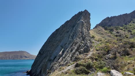 Witness-the-striking-rock-formations-rising-from-the-coastline-of-Crimea,-highlighting-the-region's-unique-geological-features-and-natural-beauty