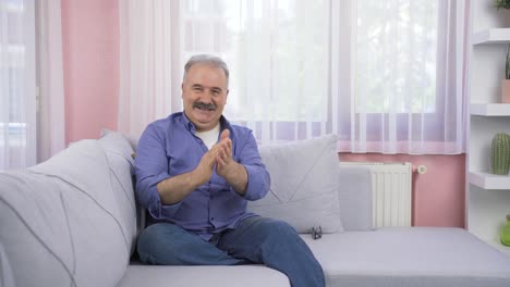 Od-man-giving-congratulatory-message-to-camera-applauding.