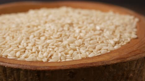 white sesame seeds in a wooden bowl