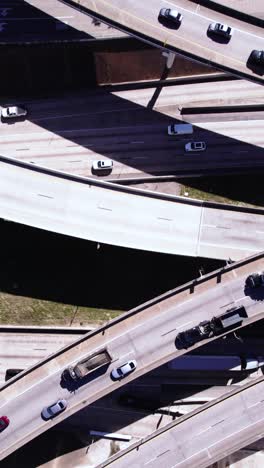 vertical drone shot, american highway junction, traffic on elevated roads, birdseye aerial view