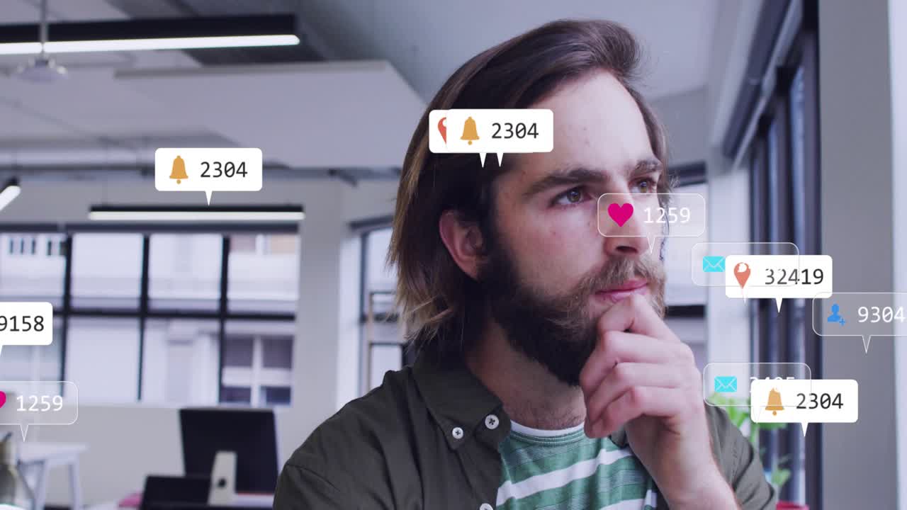 Man standing in office observing incoming notifications around him, analyzing social engagement