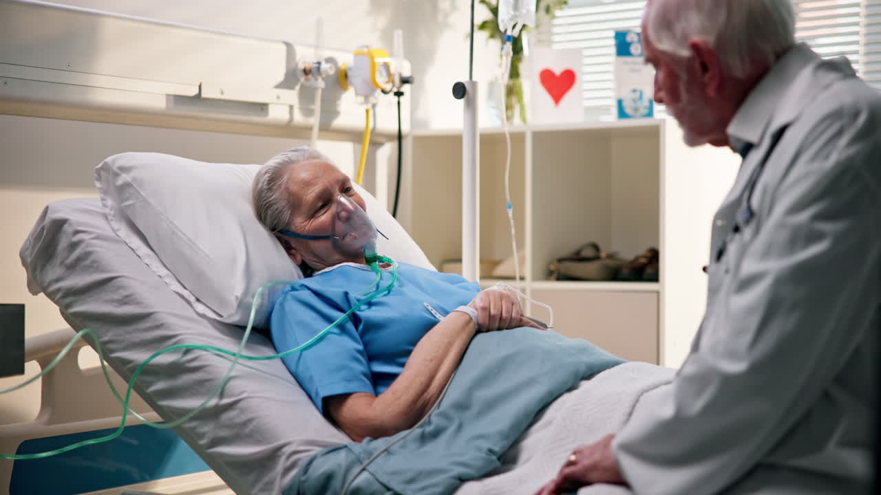 Elderly woman in hospital bed with doctor