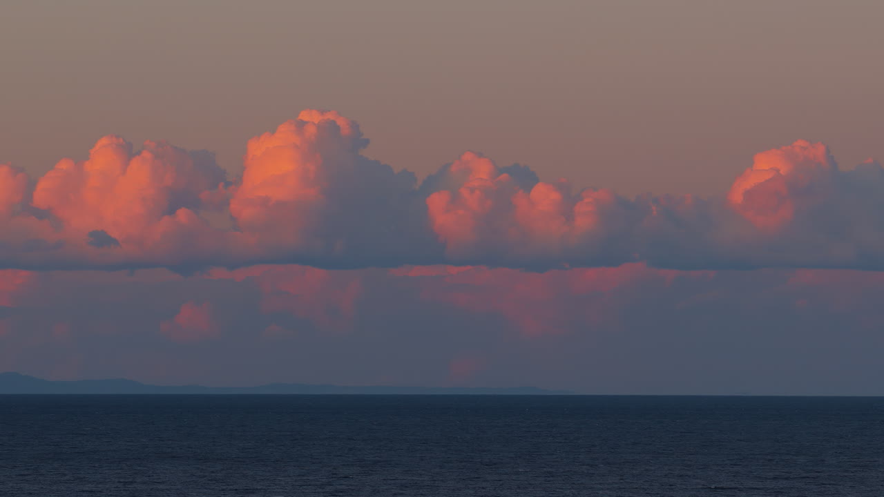 Aerial drone view of golden sunset reflecting on calm Mediterranean Sea