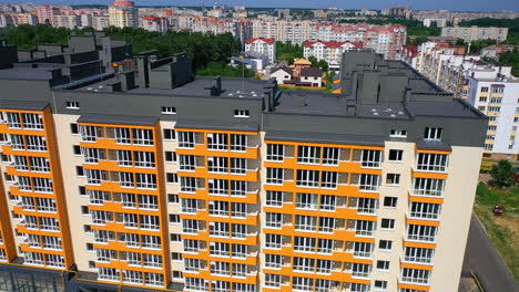 new city landmark. modern apartment building on urban background. colorful design of a multi-storey architecture. aerial view.