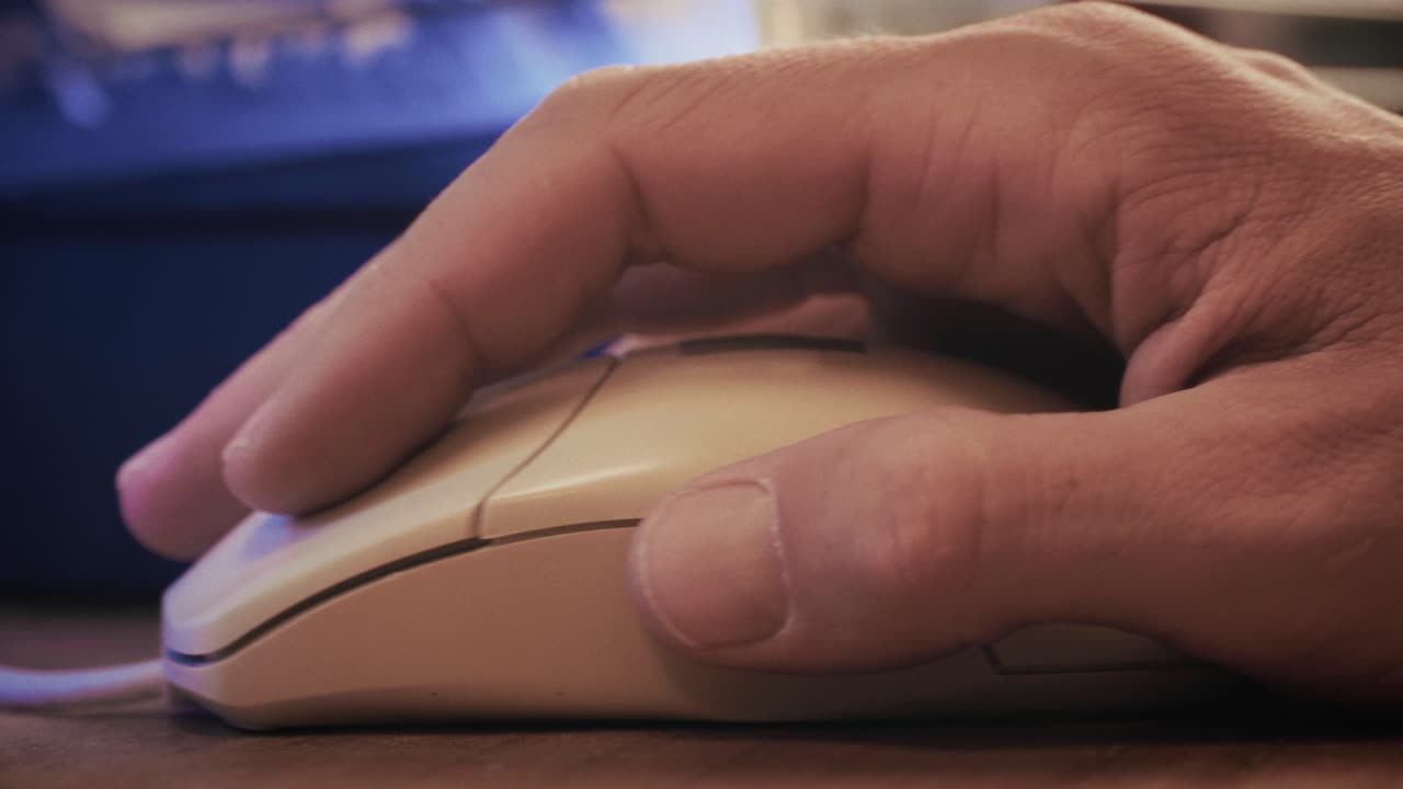 Man working and gaming on retro computer PC, IT engineer with vintage computer at home, using old fashion technology, close up of retro setup.