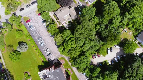 Aerial-top-down-of-planned-and-urbanized-city-with-independent-villas-surrounded-by-green-belt-on-sunny-day