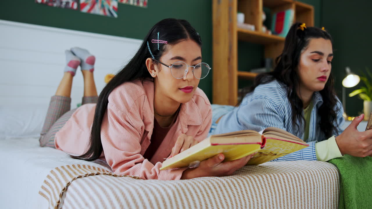 Two women reading in bed