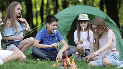 Family with Children Having Picnic in Nature Enjoying Sunset Family with Children Having Picnic in the Nature Enjoying Sunset Parents Dacing in front of Children