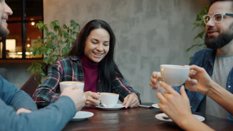 friends enjoying coffee at cafe