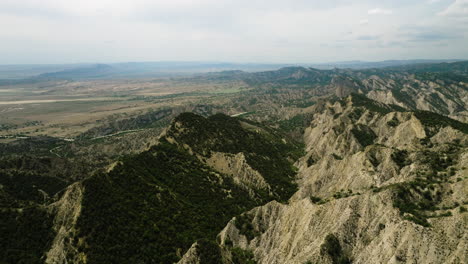 ragged sandstone hills overlooking vashlovani steppe in georgia