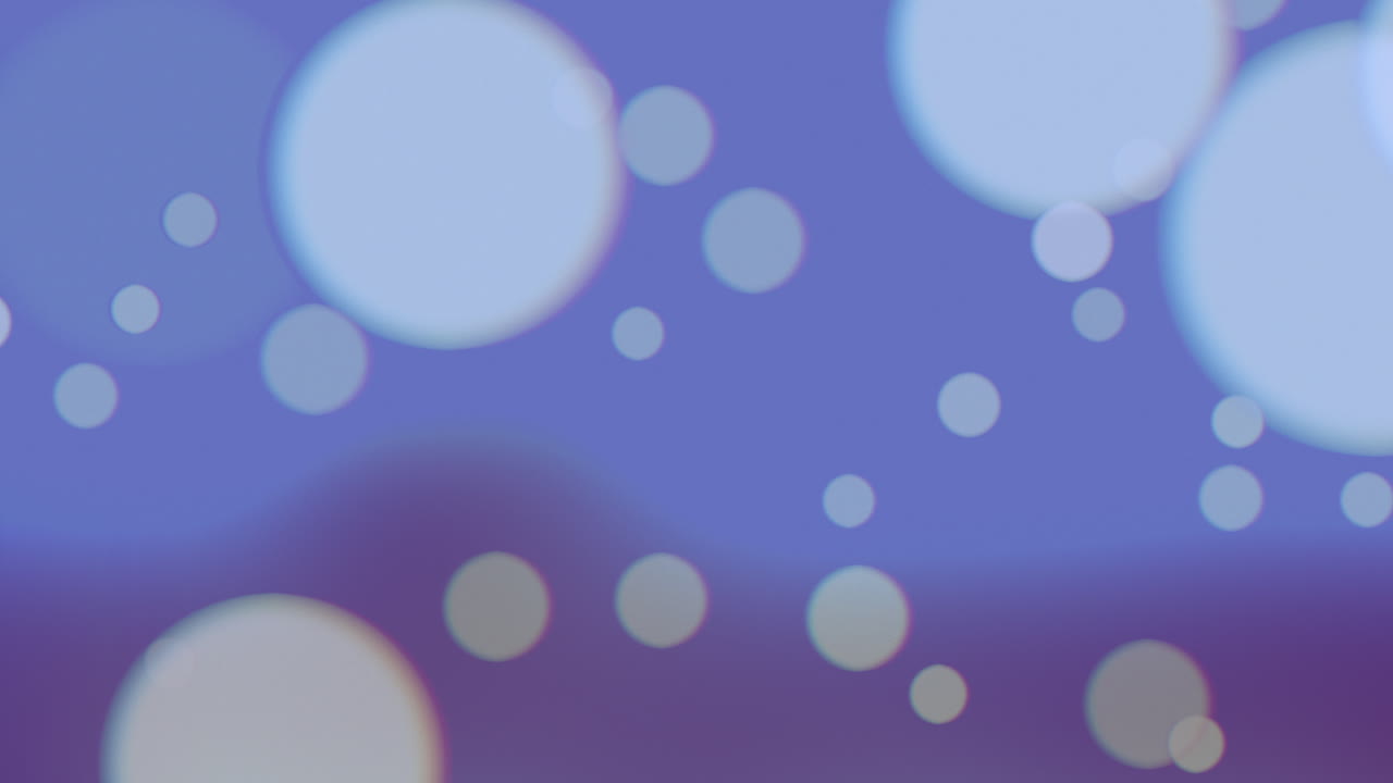 산란한 보케 산란한 보라색과 파란색 배경에 산란한 점들이 있습니다.
