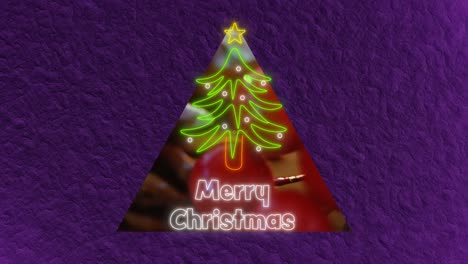 animación del texto de feliz navidad sobre el árbol de navidad