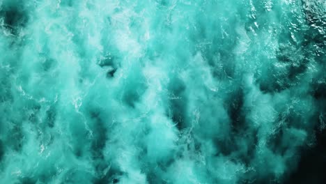 Aerial-shot-directly-above-the-choppy-white-wash-ocean-waters-on-a-stormy-day-in-the-Pacific-Ocean