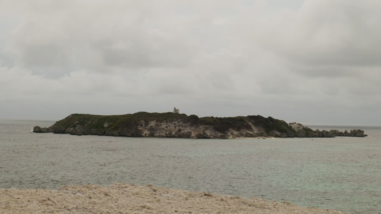 A beautiful view of Hamelin Island, showcasing its pristine beach, clear waters, and unspoiled natural environment.