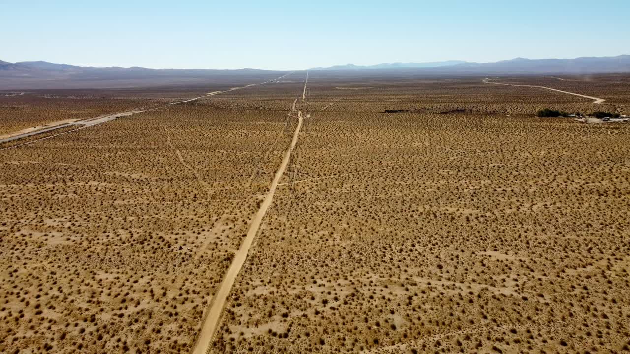 USA, CA, Mojave, Indian Wells, 45585 - Drone view in the California desert near Mojave and Indian Wells. Showing a line of high tension power lines and highway CA-14.