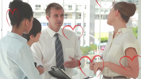 animation of heart icons falling over diverse business people in office