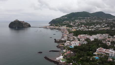 coast city borgo di celsa and castle aragonese on island ischia, italy, drone