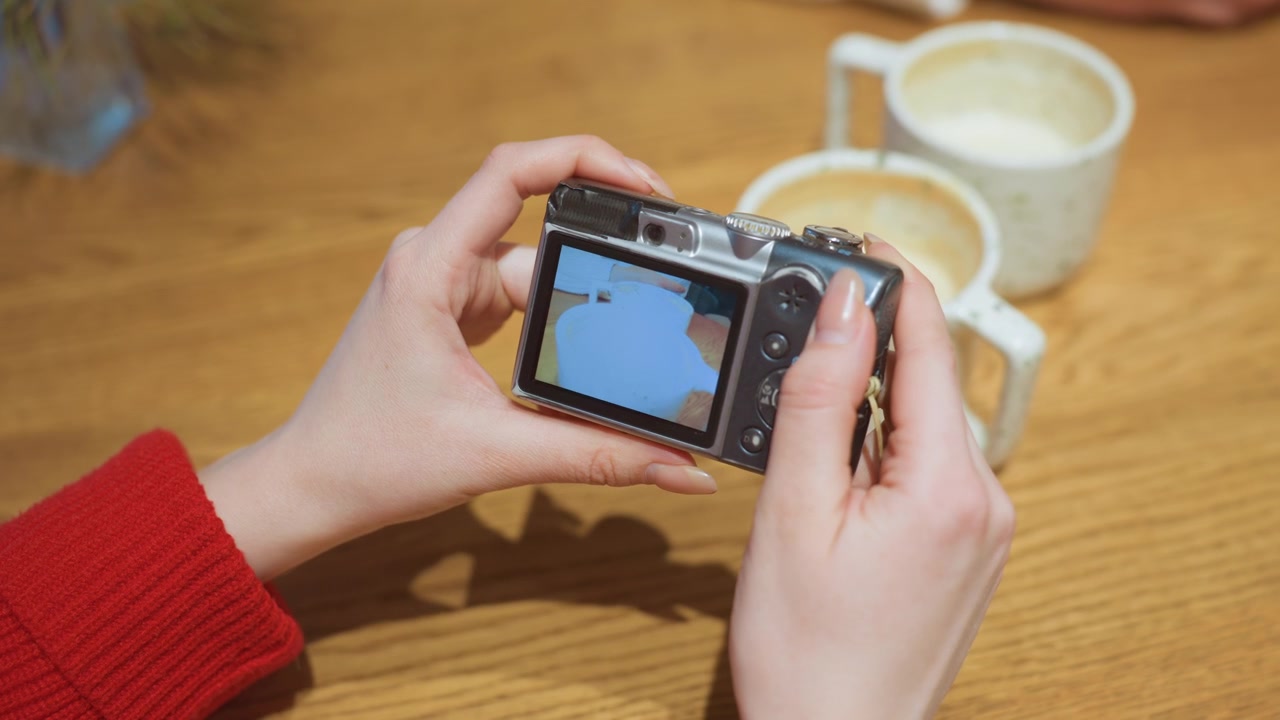 Woman's Hands Viewing Coffee Photos on Digital Camera Screen