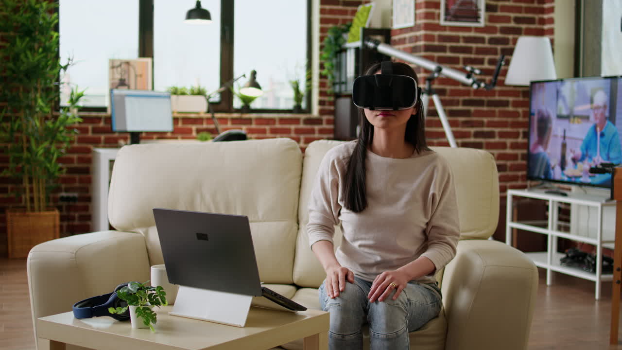 Woman using virtual reality headset in living room