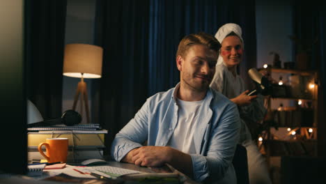videocalling man ignoring housewife at home closeup. woman distracting boyfriend