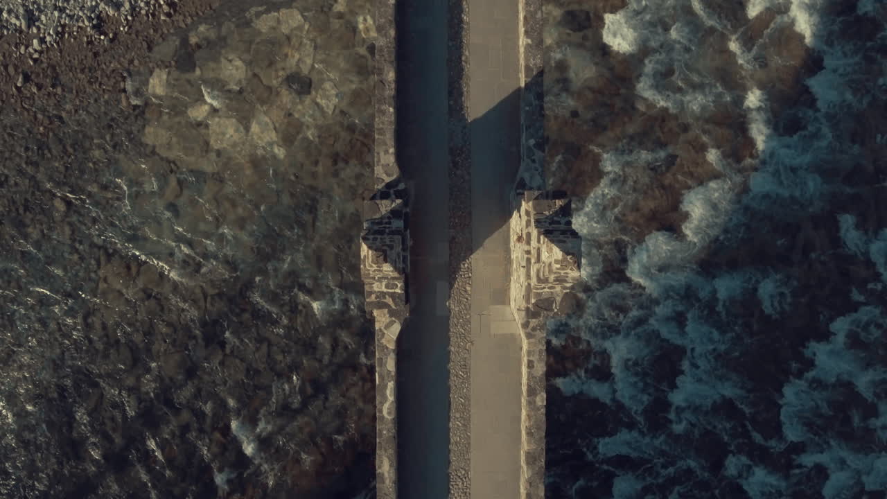 4K Symmetric Zenithal Aerial Drone view of historical old stone bridge