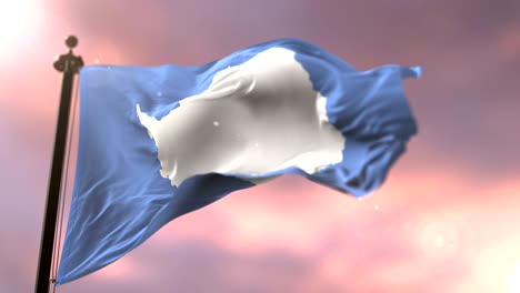 la bandera de la antártida ondeando lentamente al atardecer, en bucle