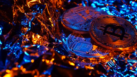 Bitcoin Coins on Foil with Neon Lighting