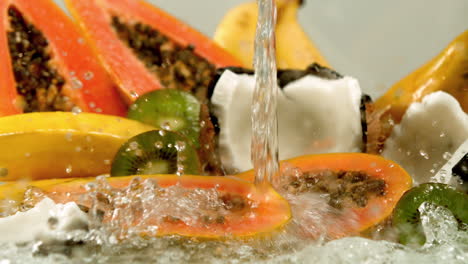 water pouring over tropical fruit