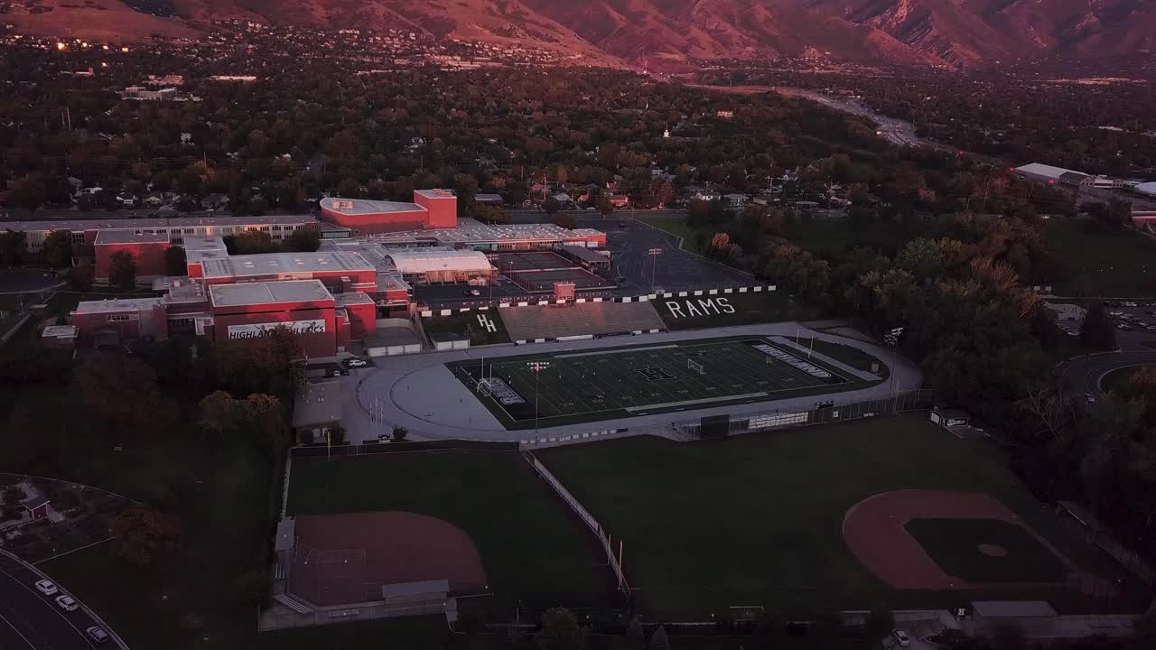 Cinematic Drone Footage of Utah High School featuring Mountain Background
