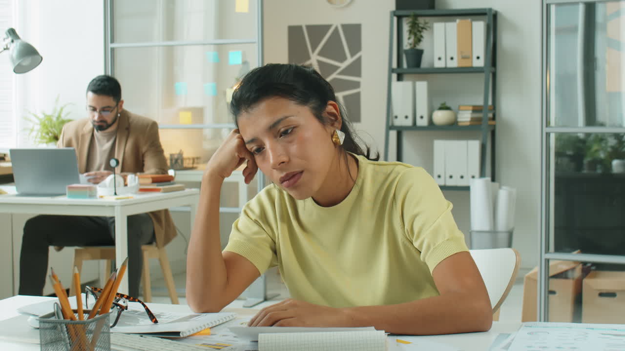 Time Lapse of Tired Businesswoman at Desk during Day in Office