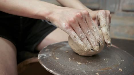 young woman makes a jug of clay. female hands mold pottery