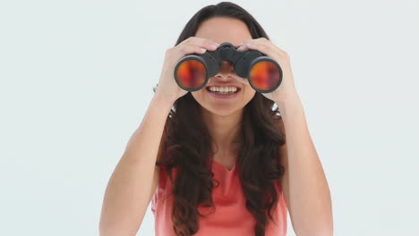 young woman using binoculars