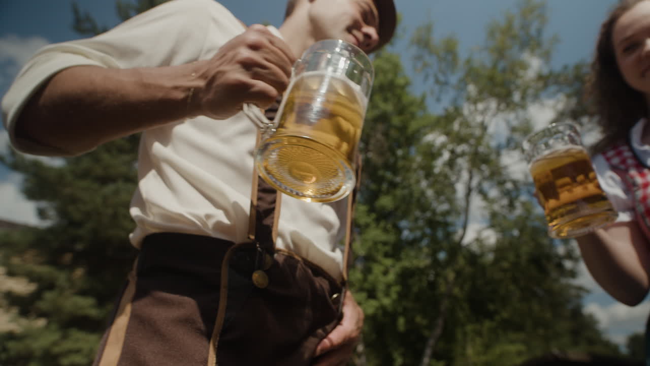 Oktoberfest celebration with people raising beer glasses