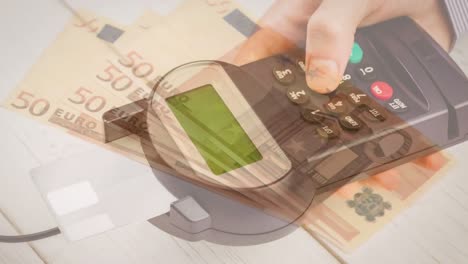 Animation-of-euro-banknotes-falling-over-hand-of-caucasian-man-holding-payment-terminal