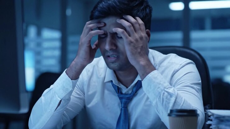 A Focused Worker Encountering Stress While Engaged in Intense Analysis at a Late-Night Office Setting Striving for Solutions Amidst Challenging Tasks
