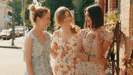 three women friends enjoying a stroll in city