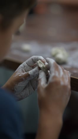 child making dumplings