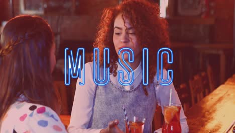 animation of blue music neon text over diverse friends drinking and talking in bar