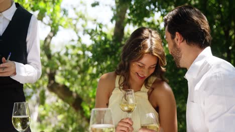 happy couple toasting wine glasses
