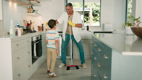 cleaning, dad and child dance in the kitchen