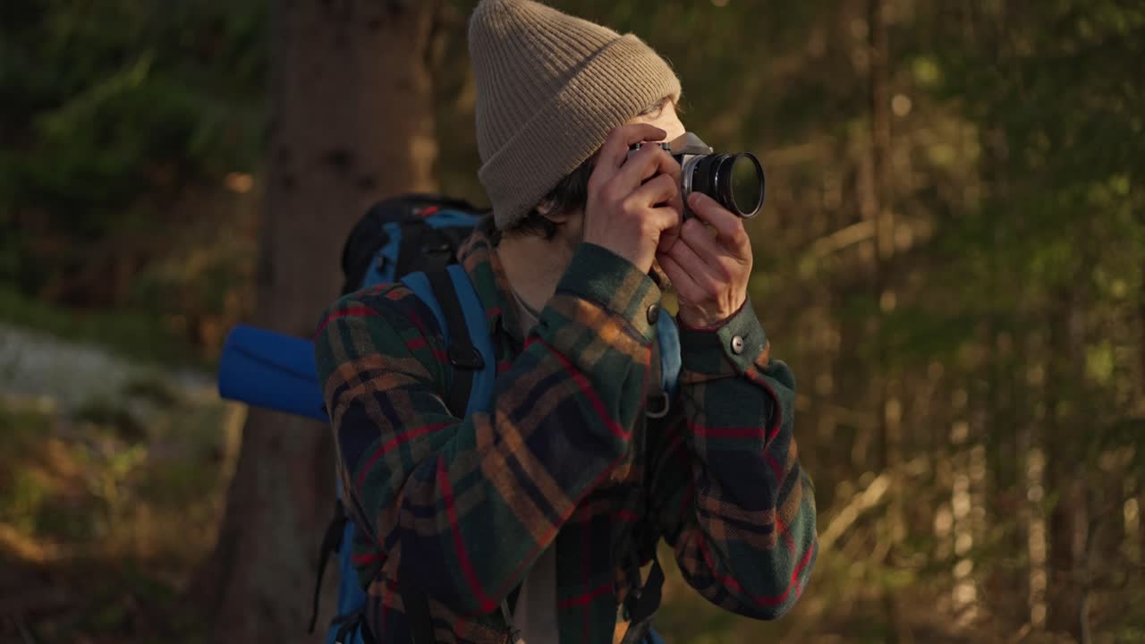 Photographer in a forest taking pictures