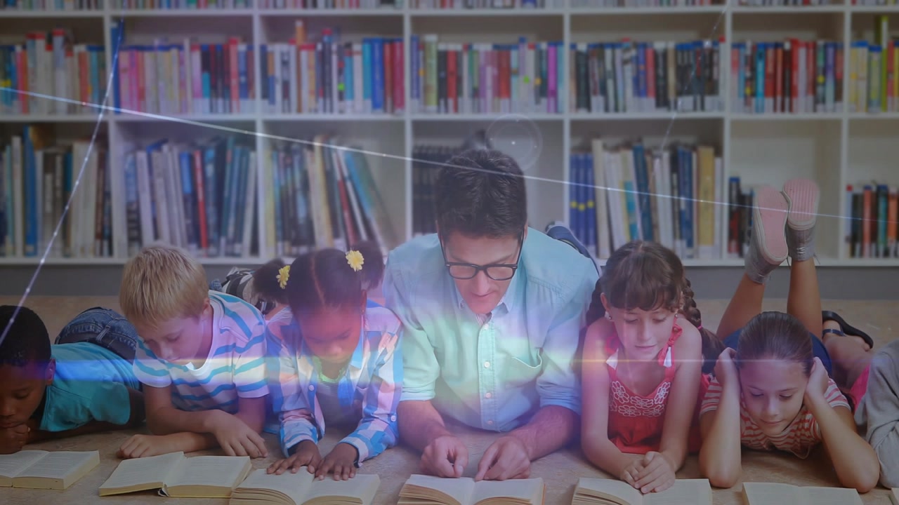 Teacher leaning toward girl, checking books and guiding reading, students tracing lines in library