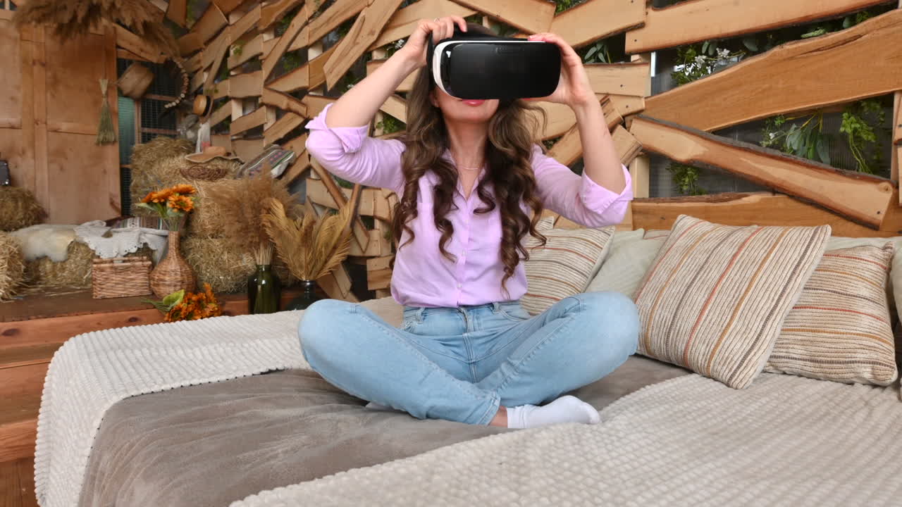 Woman putting on VR headset and enjoying it