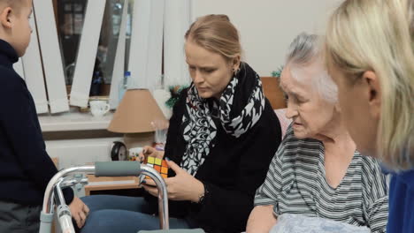 elderly woman having visitors in hospital