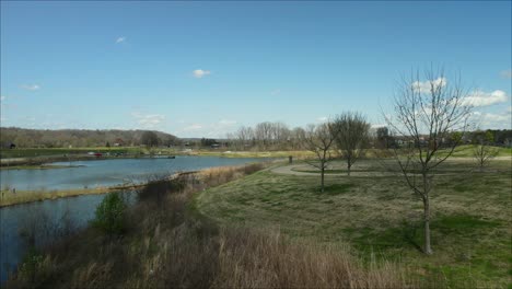 flying towards and revealing a fishing pond at liberty park in clarksville, tennessee