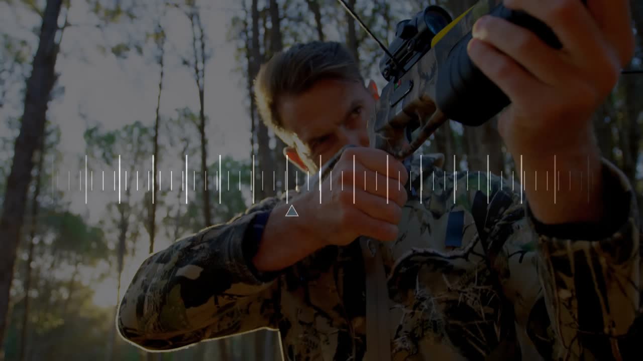 Man raising crossbow among pine forest sunlight, adjusting grip and aiming with scope for hunting